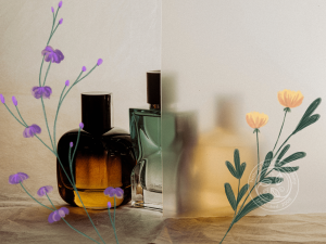 three Perfume bottles behind decorated frosted glass with floral motif