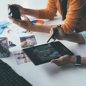 Desk with people working on devices