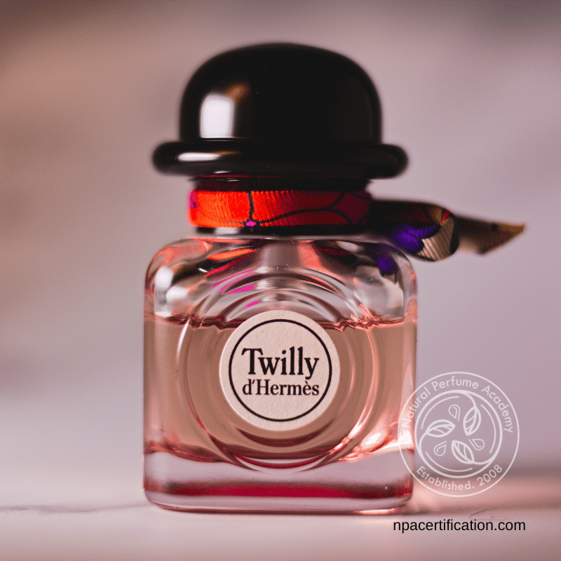 Twilly d’Hermès perfume bottle with signature ribbon and cap, showcasing a luxurious and stylish fragrance.