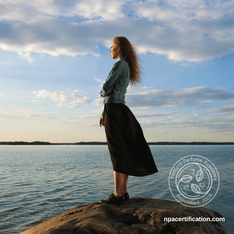 An Irish woman looking out across the horizon dreaming of a custom perfume