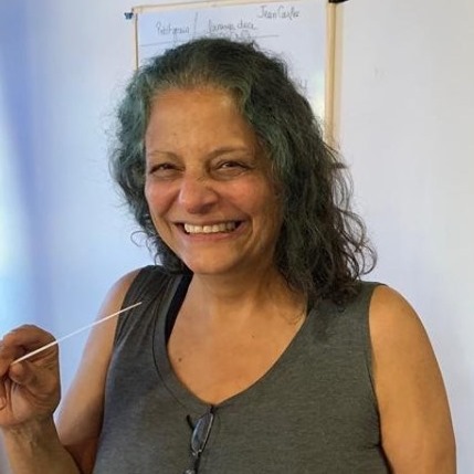 Ane Walsh Smiling, Smelling a perfume scent strip